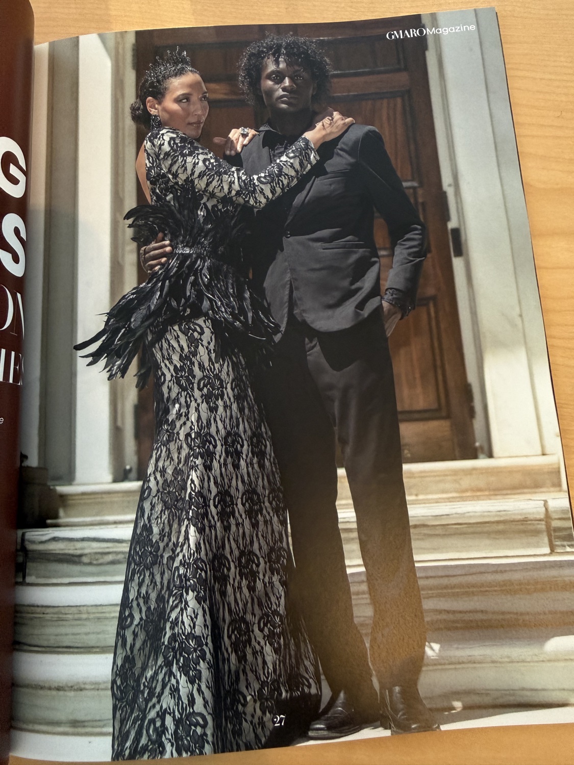 GMARO Magazine editorial 'Breaking the Rules' — model in a black lace bridal gown with feather detail, designed by Dr. Bonita Best